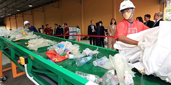 material being loaded into recycling equipment