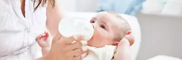 Mother feeding her son